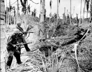 Soldiers flush out a Japanese hideout on New Guinea Soldiers flush out a Japanese hideout on New Guinea