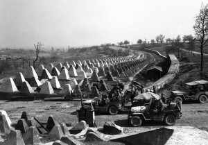US Army pour through a breach in the Siegfried Line defenses, on their way to Karlsruhe, Germany US Army pour through a breach in the Siegfried Line defenses, on their way to Karlsruhe, Germany
